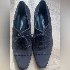 Black suede Manolo Blahnik lace up loafers.
